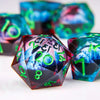 A close-up of a liquid core resin die with a dragon eye design, showing vibrant blue and green colors.