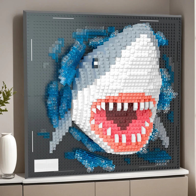 A framed piece of wall art featuring a white and blue mosaic design resembling a fierce animal head.