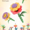 A colorful flower garden building toy featuring various sculpted flowers and plants for kids.