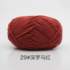 A ball of deep red 29-ply yarn for knitting and crochet