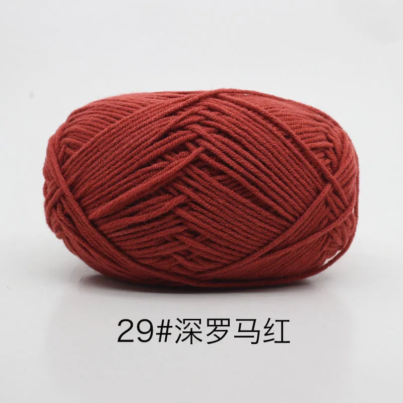 A ball of deep red 29-ply yarn for knitting and crochet