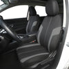 A black car seat cover set installed in a vehicle interior, showing the front seat and driver's side door panel.