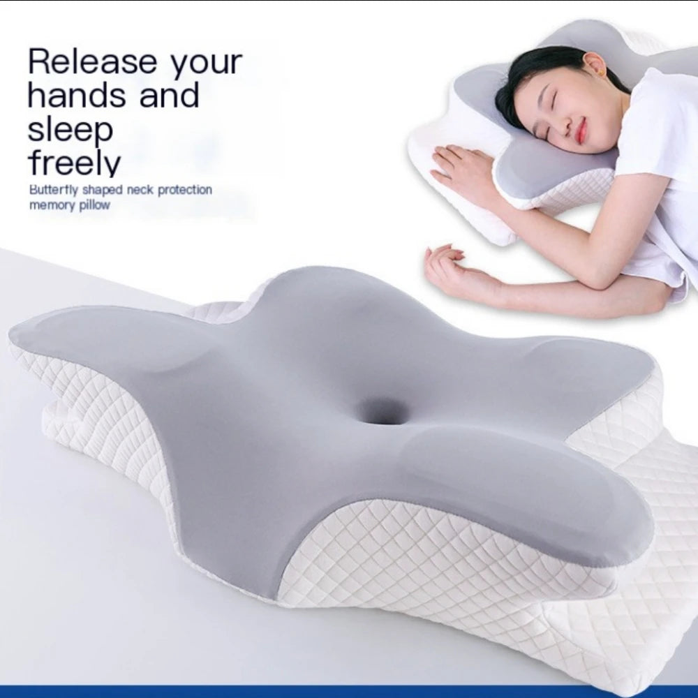 A person is resting their head on a butterfly-shaped memory foam pillow for neck pain relief.