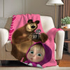 A plush toy of a bear and a baby face are featured on a pink fleece throw blanket.