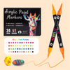 A set of black acrylic paint markers with orange tips and a palette of colored paint markers for crafts