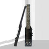 A black silent electric acoustic guitar with an active pickup, shown vertically.