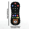 Black silicone baby teether shaped like a bear with various buttons and anti-slip features