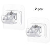 A set of two clear plastic no-drill adhesive curtain rod brackets for mounting curtains.