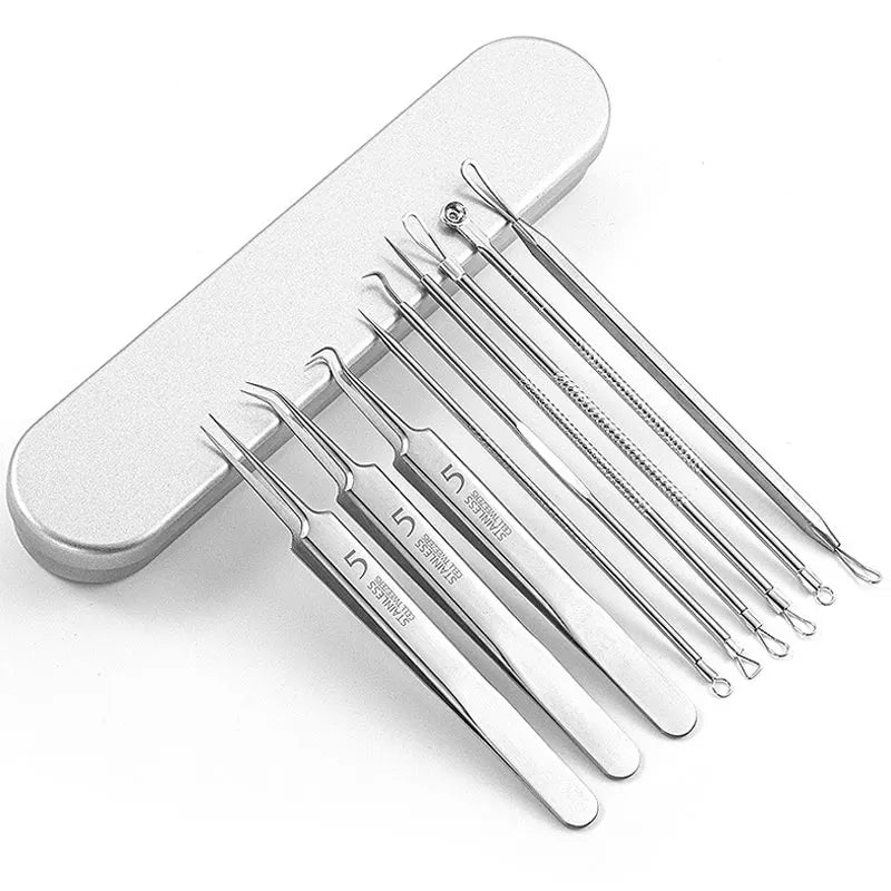 A set of stainless steel acne and blackhead removal tools with fine tips displayed on a white handle.