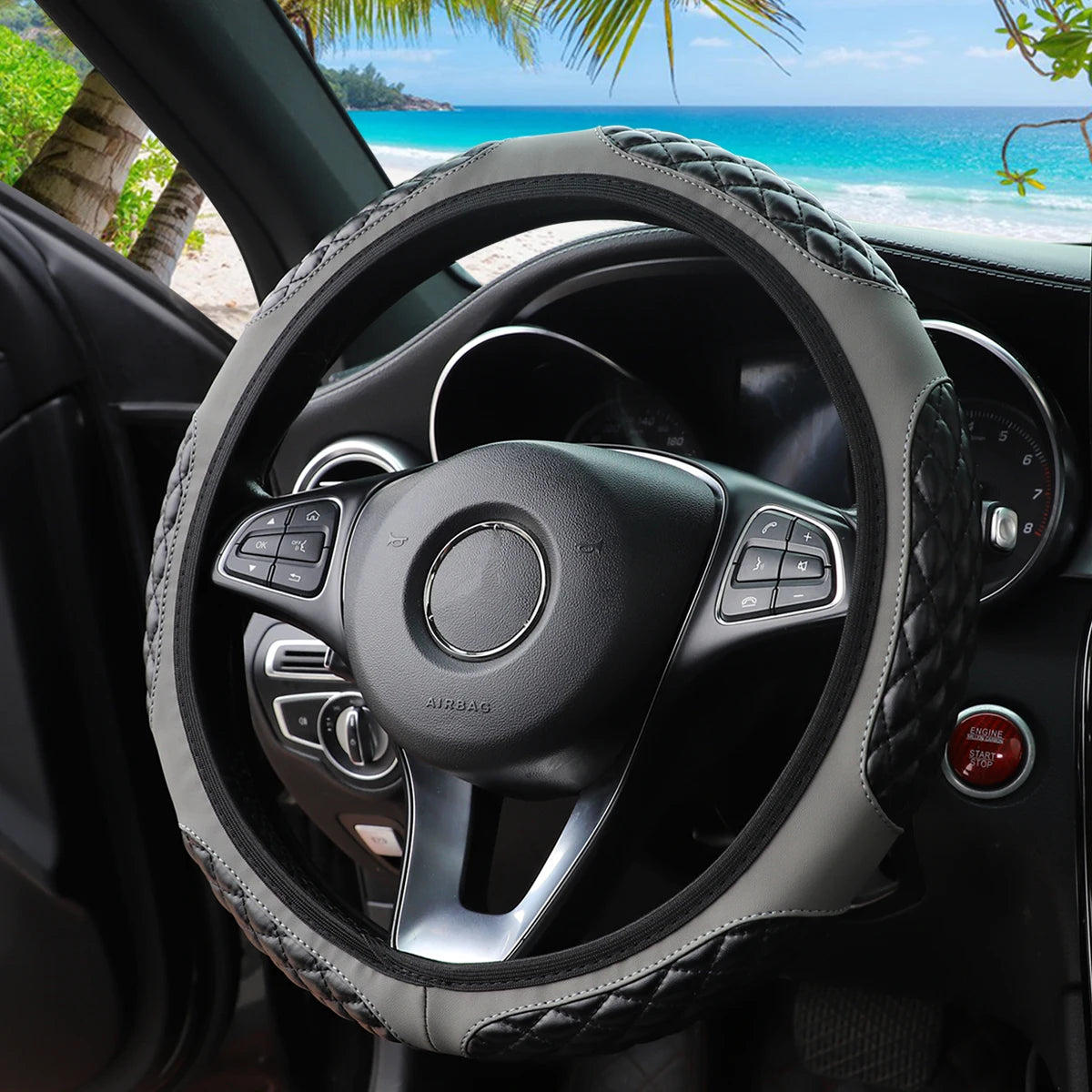 A close-up view of a black steering wheel with a faux sheepskin leather cover inside a car interior.