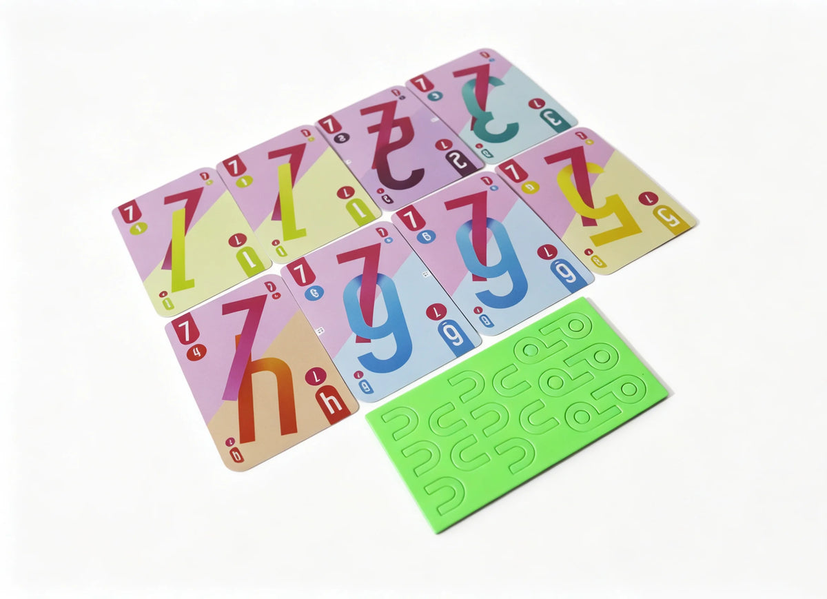A collection of colorful Omega cards and a green card game board are displayed on a white background.