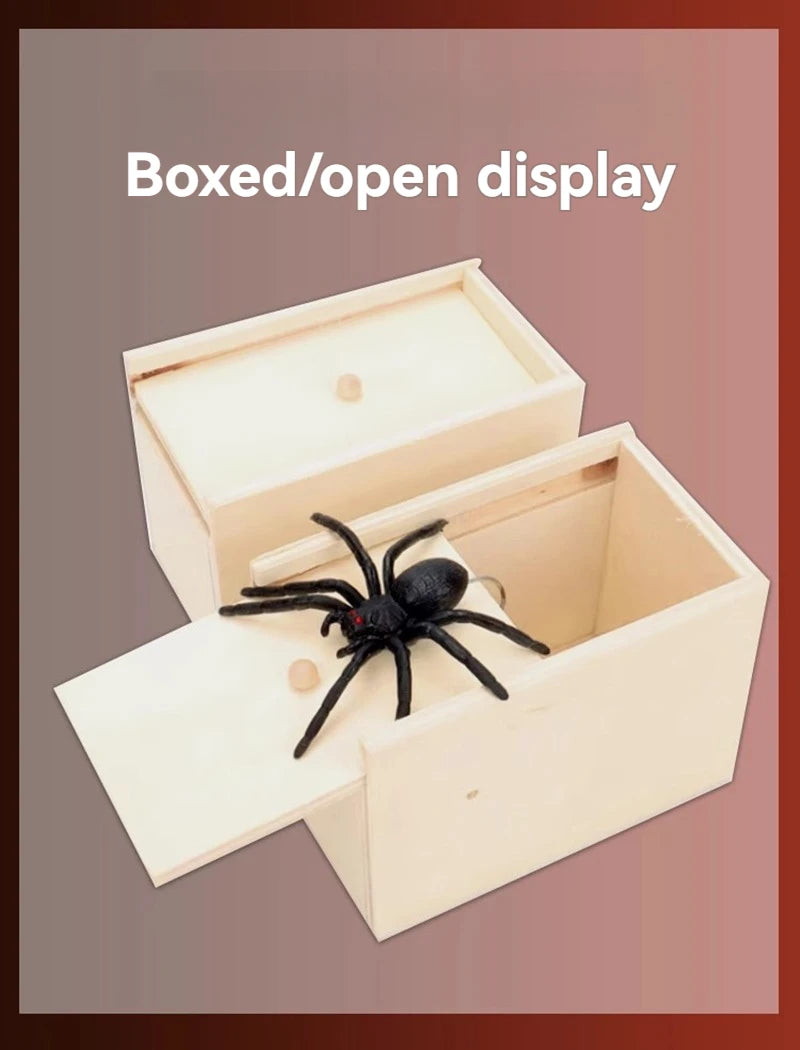 A wooden boxed or open display featuring a black spider inside.