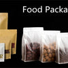 A collection of clear food packaging bags filled with various dry goods like nuts, grains, and candies.