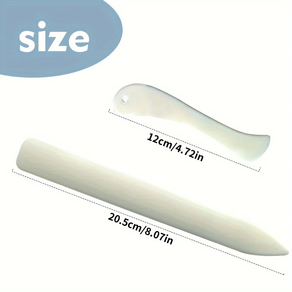 A set of plastic bone folders and crease markers for paper and leather crafts shown in various sizes.