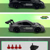 Black and gray RC drift trucks with barriers and drifting tires shown next to a remote control