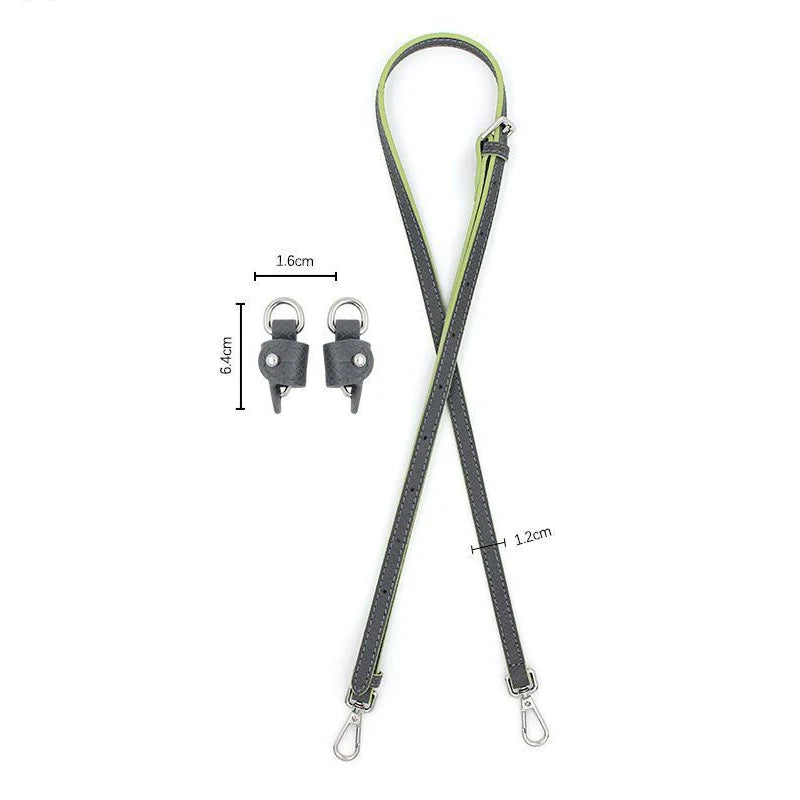 A black leather shoulder strap with a silver clasp and adjustable length is shown against a white background.