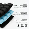 A black seat cushion with a blue top layer and anti-slip base, showing features like water resistance and pressure relief.