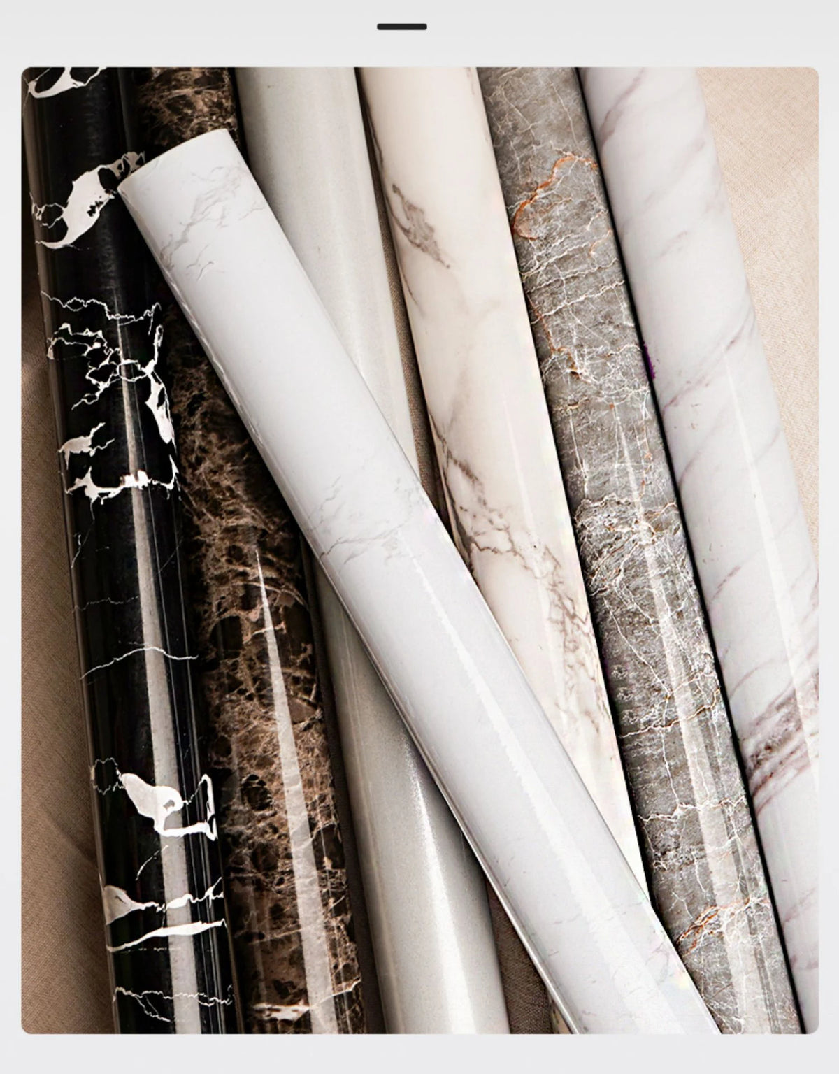 Rolls of marble effect self-adhesive PVC film in various shades and patterns for countertops and cabinets