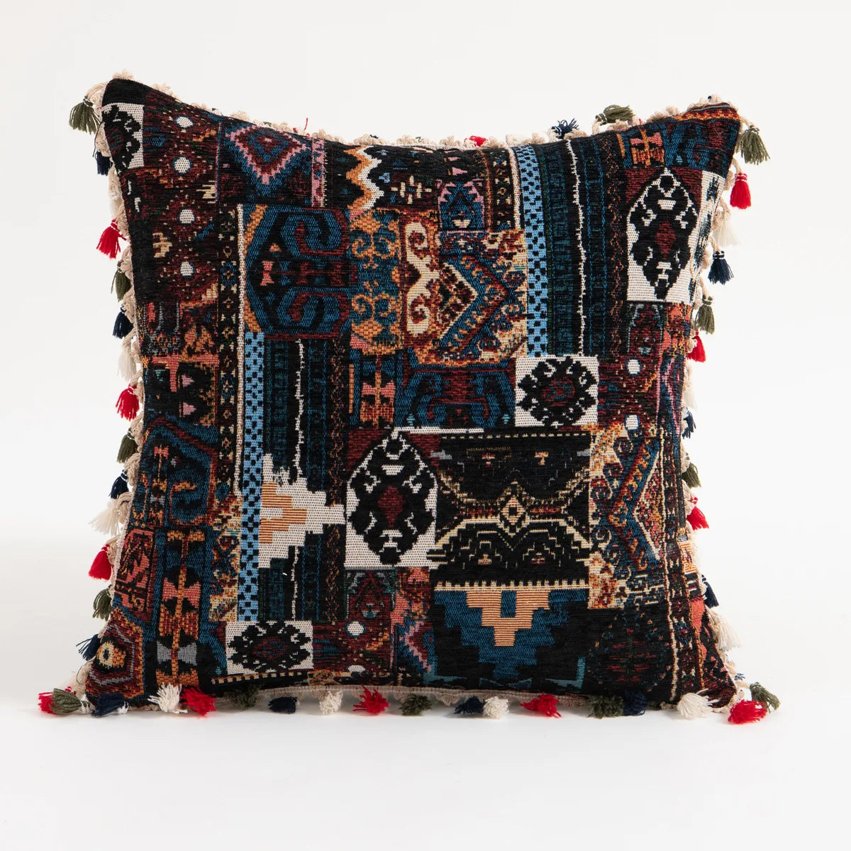 A square throw pillow cover featuring a dark, bohemian leaf-print pattern with tassels along the edges.