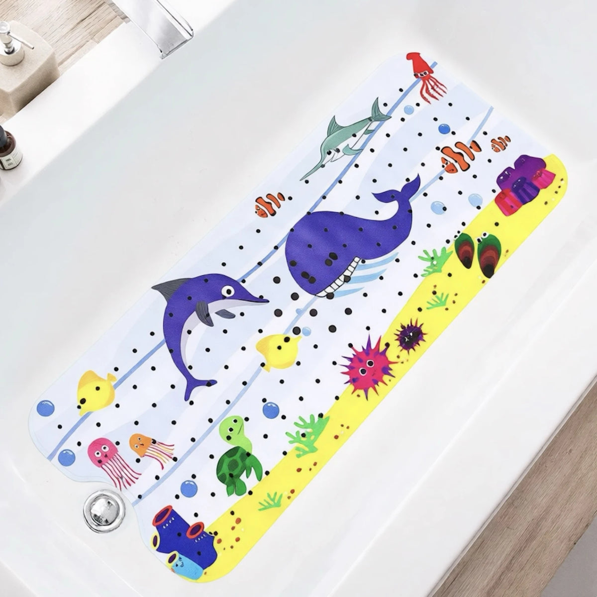 A colorful cartoon bathtub mat featuring sea creatures and fish with suction cups