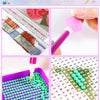 A floral diamond painting kit showing various colored beads and a pink tool for working on a grid.