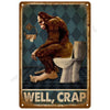 A vintage metal tin sign depicting a brown monkey sitting on a toilet with the text WELL CRAP.