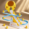 A yellow and blue plastic toy featuring a duck climbing track with various figures.