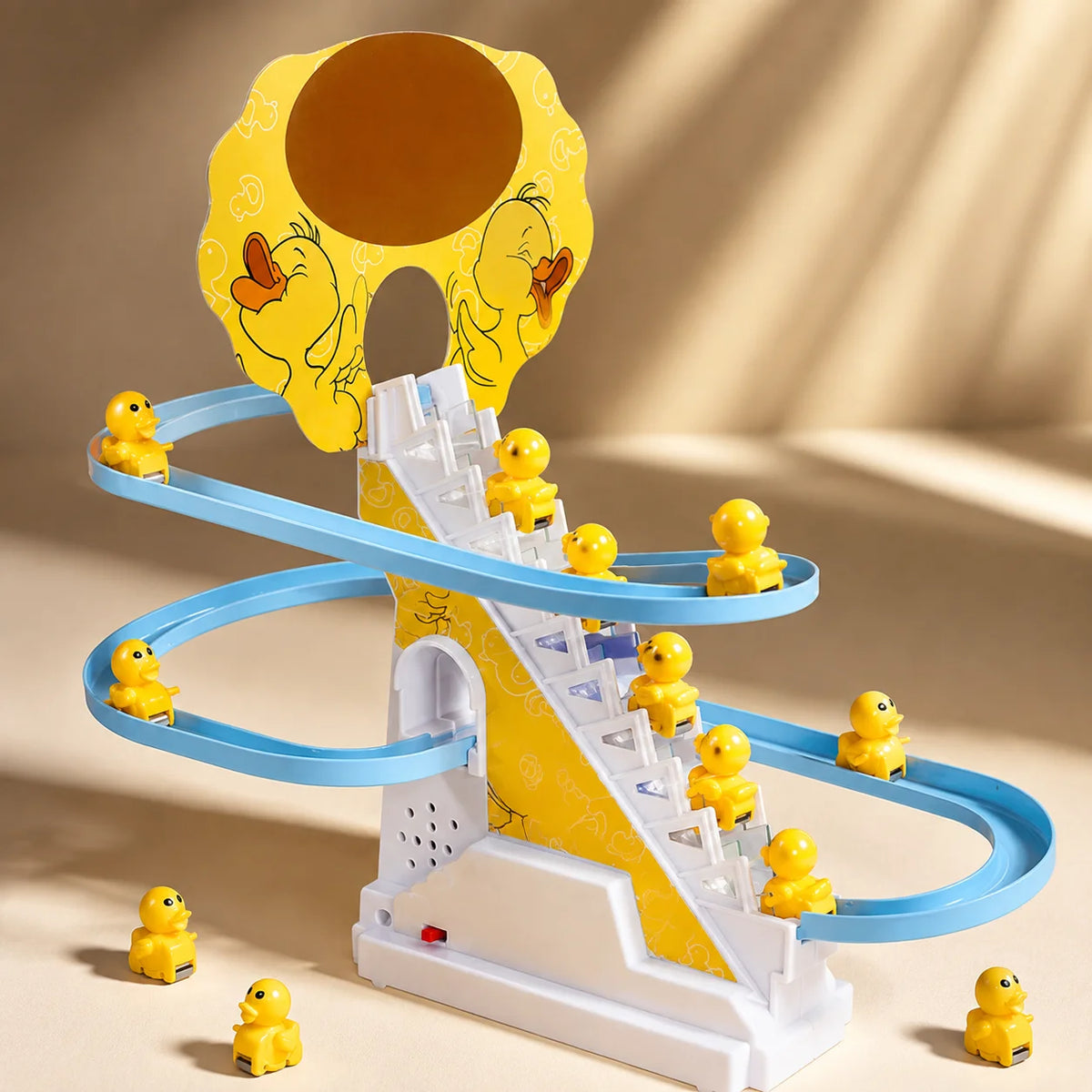 A yellow and blue plastic toy featuring a duck climbing track with various figures.