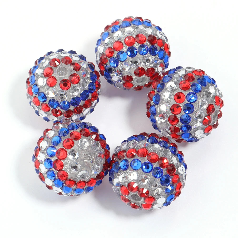A set of five resin rhinestone beads with a two-tone red and blue striped design.