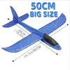 A blue foam glider plane with wings and a black nose, shown in a side view.