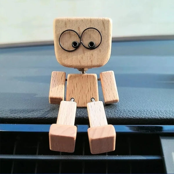 Handcrafted wooden shaking man figurine with a square body and circular eyes