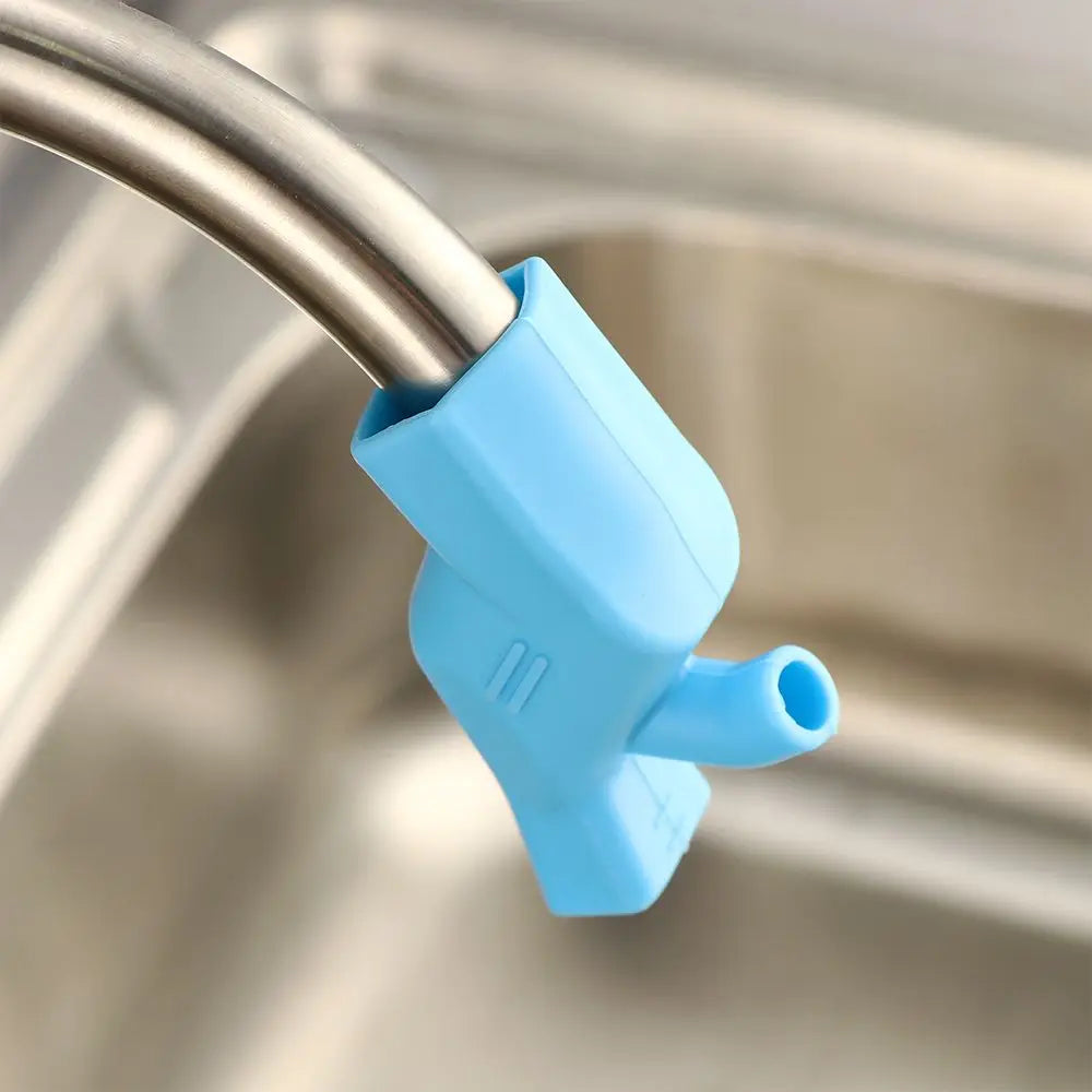 A light blue flexible silicone faucet extender is attached to a metal faucet, used for handwashing or as a faucet accessory.