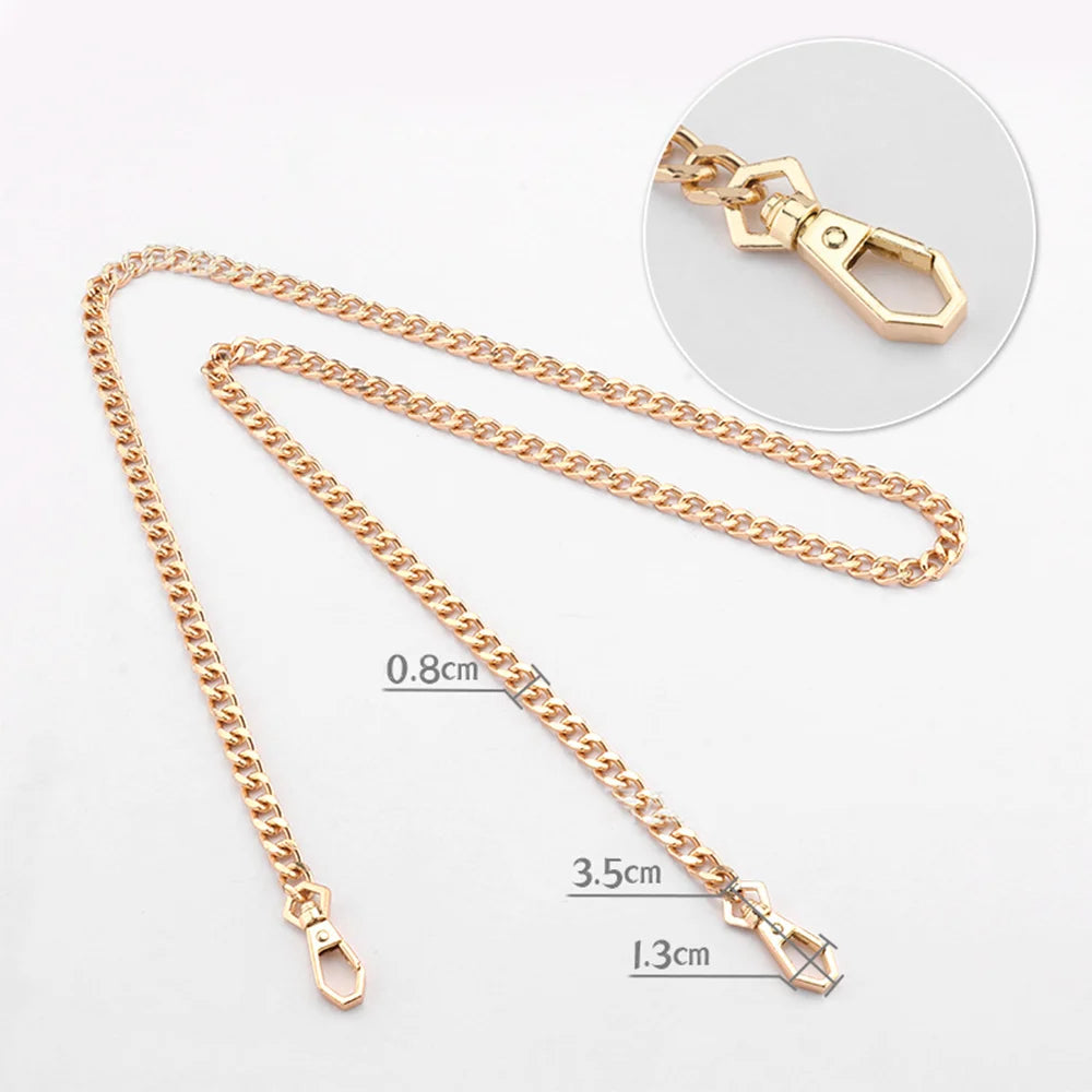 Gold-toned metal purse chain with adjustable buckles shown next to a separate link and a circular view.