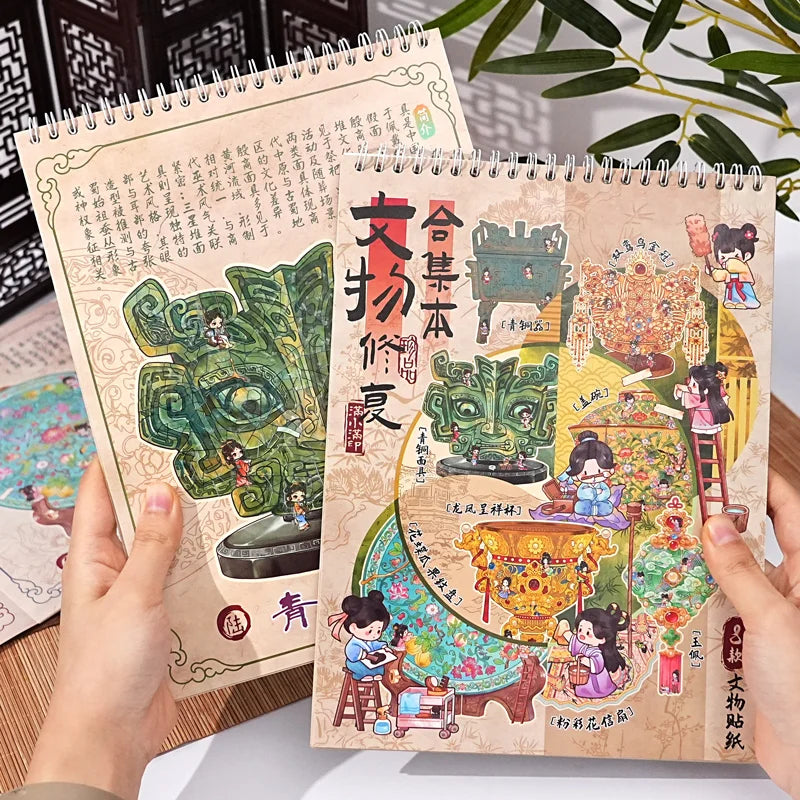 A pair of handmade paper notebooks featuring detailed 3D sticker scenes depicting pocket cabins and landscape crafts.