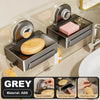 Grey wall-mounted soap dish with drain tray made of ABS featuring quick installation and a one-piece hook.