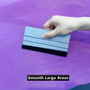 A hand is applying a smooth, light blue vinyl applicator tool onto a purple surface.
