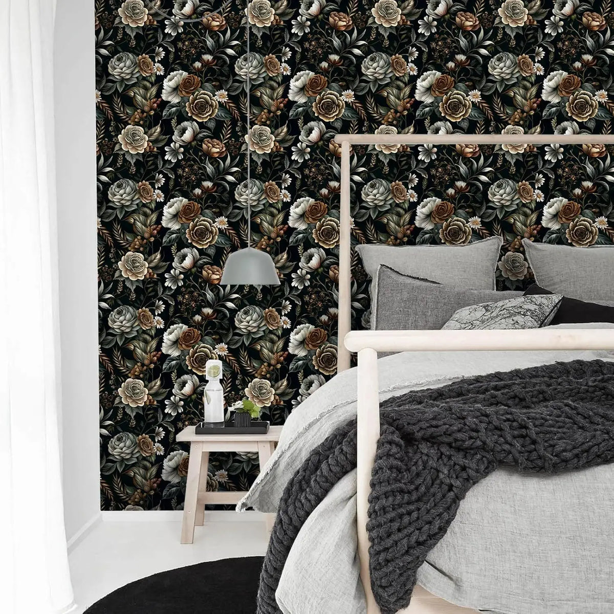 A bedroom featuring a headboard with a dark floral wallpaper and light gray bedding.