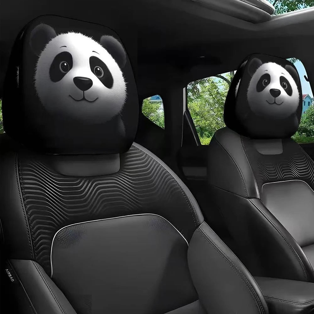 A pair of panda-themed car headrest covers accenting the interior of a vehicle.