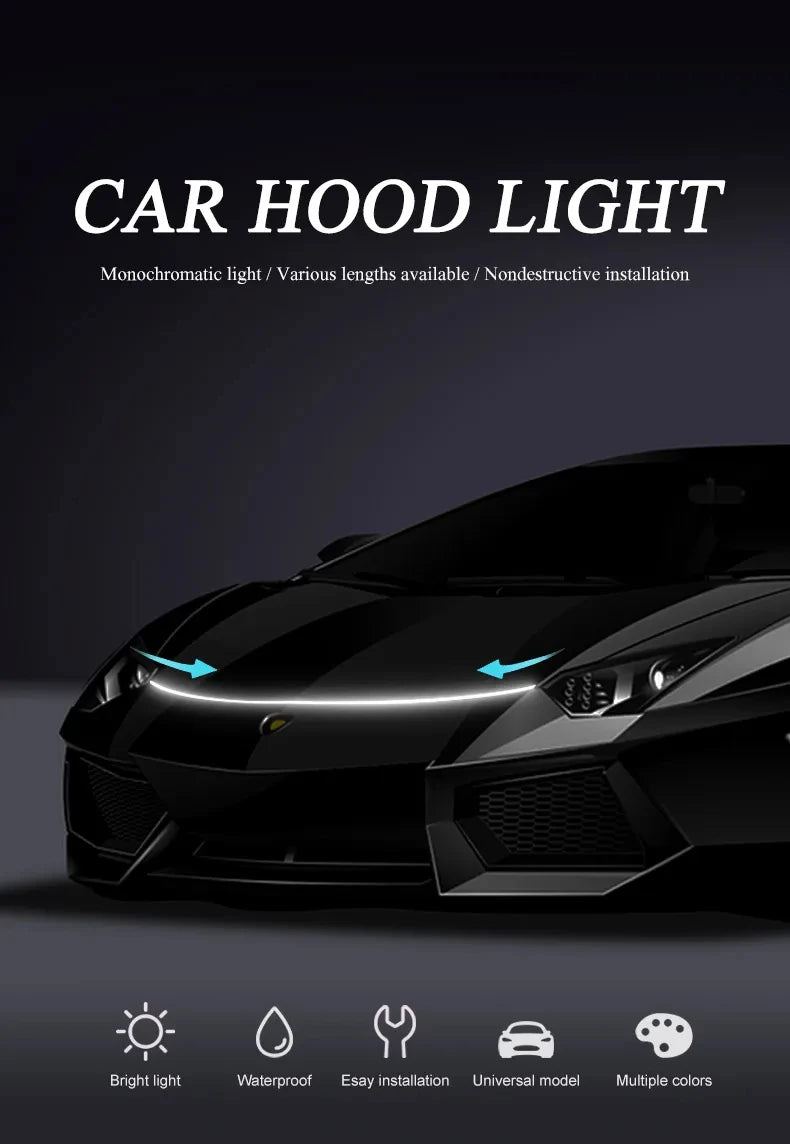 A black car hood illuminated by a bright, monochromatic LED light strip for accent lighting.