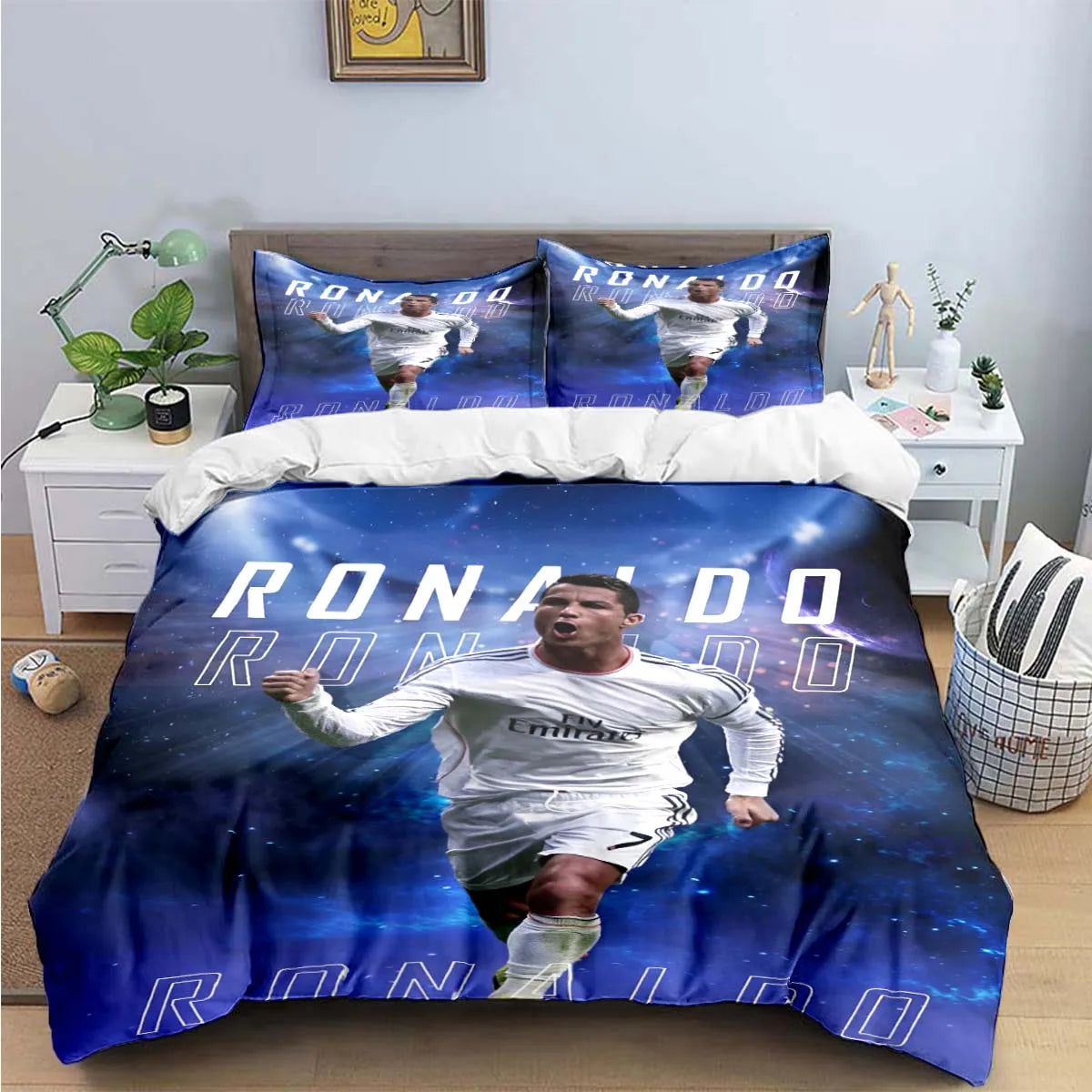 A dark blue duvet cover featuring a soccer player in a white jersey with the text RONALDO