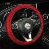 A red rhinestone steering wheel cover with a black leather rim is shown in a car interior context.