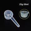 A clear plastic measuring cup with a long spout is shown against a black background, next to a size indicator.