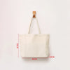 A beige canvas shopping tote bag with a wooden handle, shown flat against a white background.