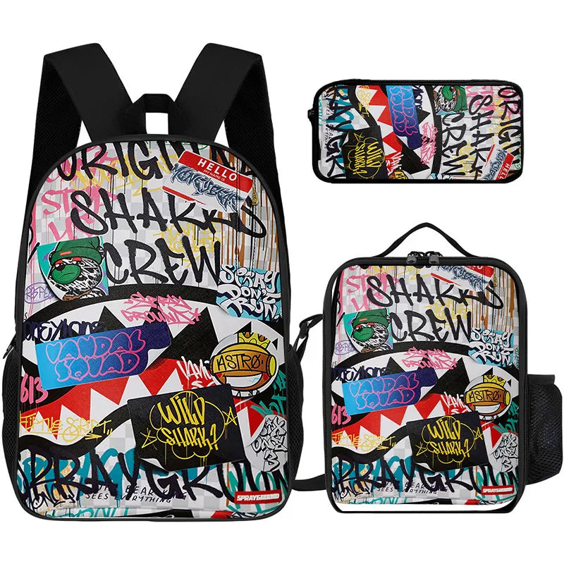 A set of three graphic cartoon print backpacks featuring shark and crew themes in various colors.