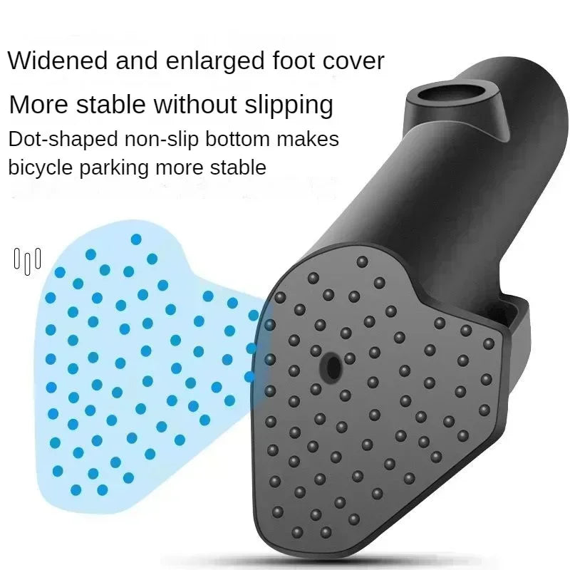 A black bicycle kickstand with a dot-shaped non-slip bottom for stable parking.