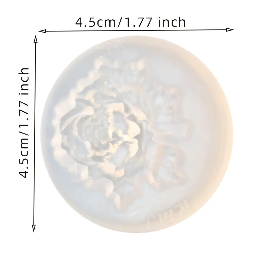 Un moule en silicone transparent rond avec un motif floral pour cire de bougie DIY.