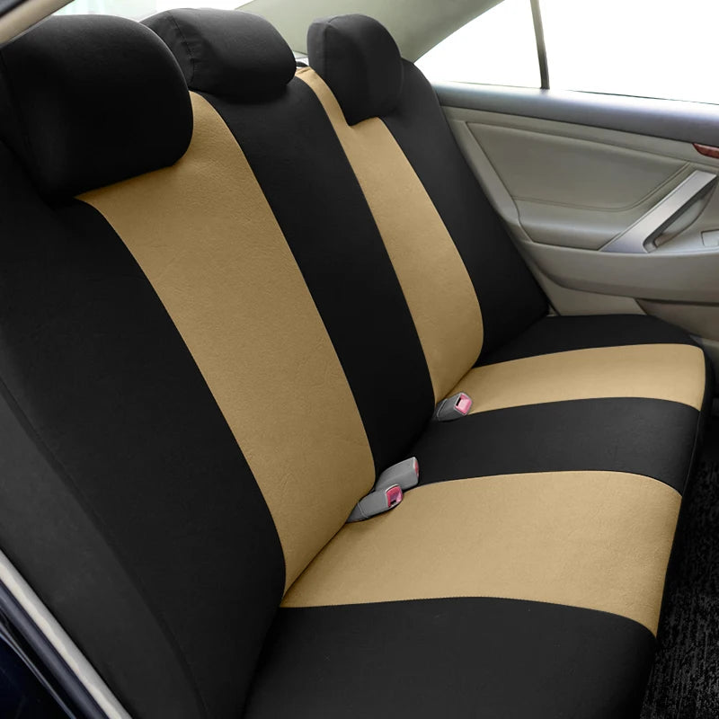 Car seat covers featuring a black and tan honeycomb mesh pattern on a vehicle seat.