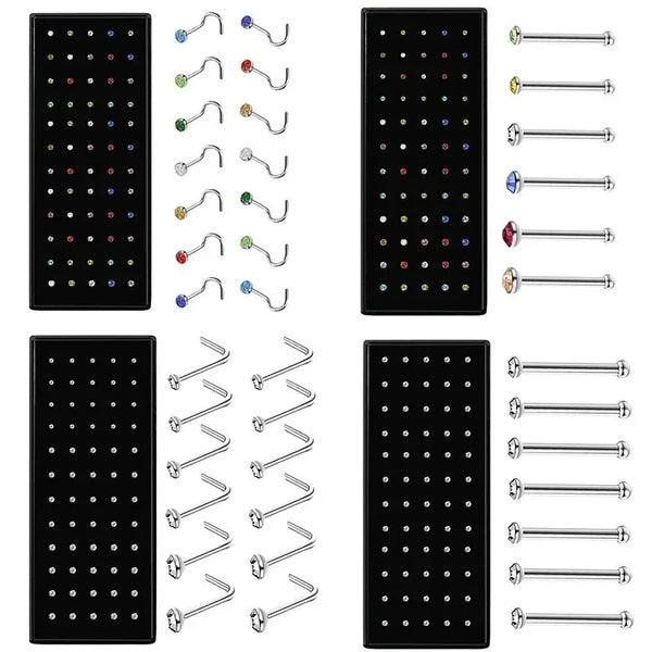 A set of geometric stainless steel nose studs and piercings in various sizes and colors.