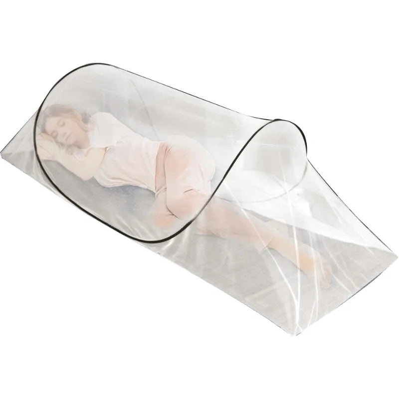 A person is lying inside a clear, portable instant pop-up mosquito net designed for single bed protection.