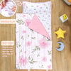 A pink floral toddler nap mat with a removable pillow and fleece blanket shown on a wooden surface.